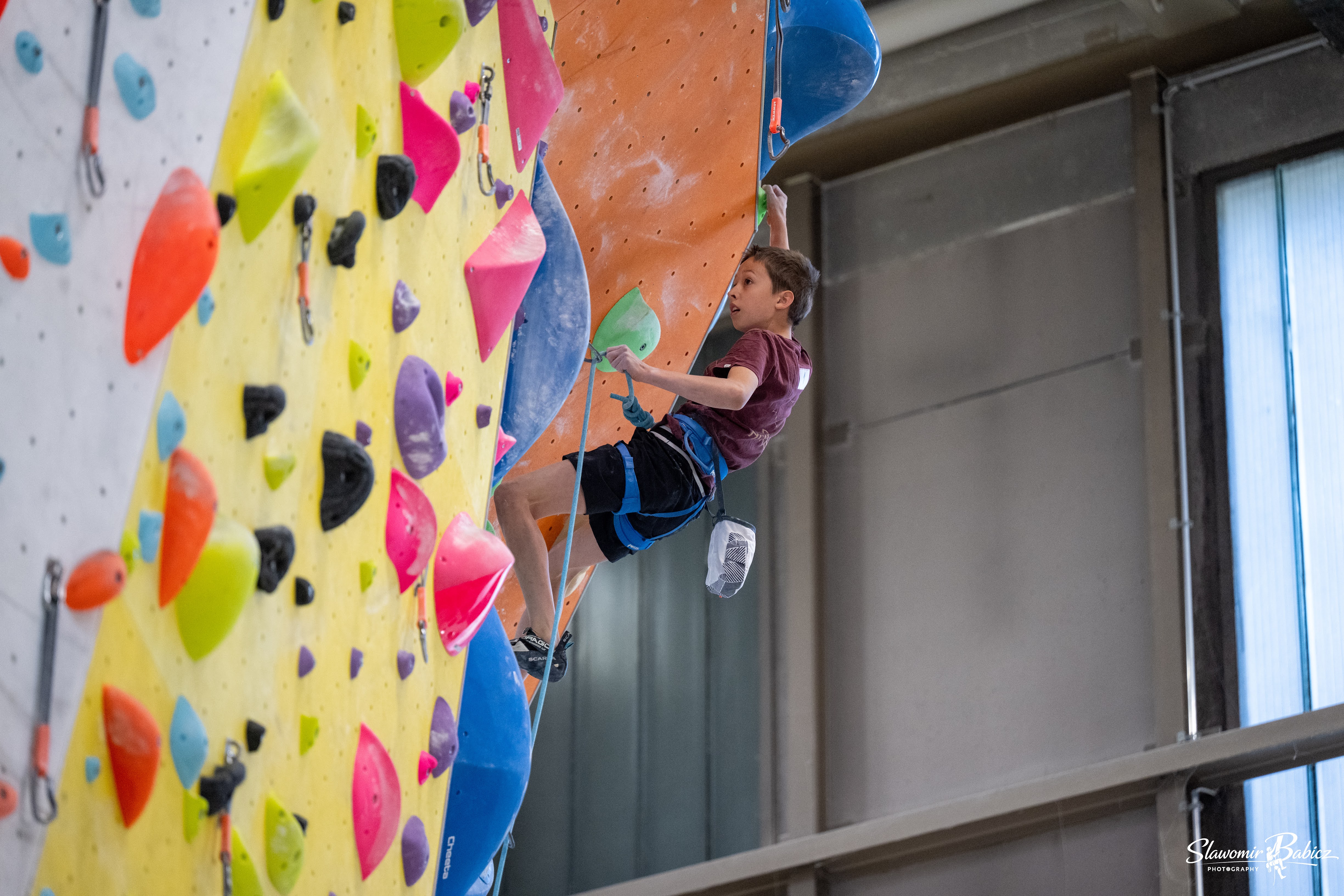 Rock climber ascending a steep face